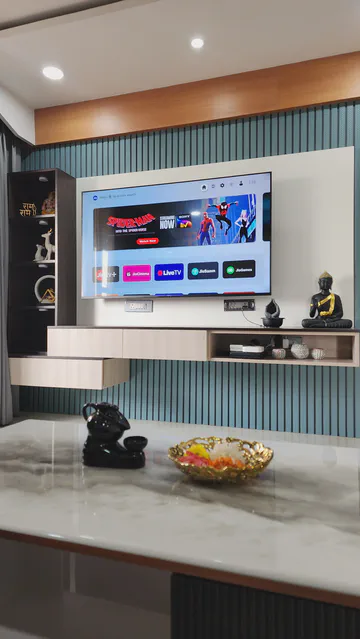 Contemporary entertainment unit with integrated display and decorative elements