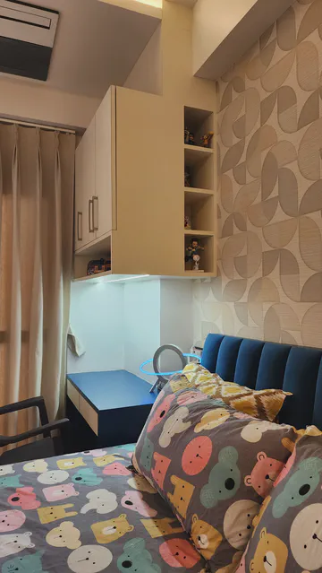 Modern children's bedroom with playful animal-themed ceiling and smart storage