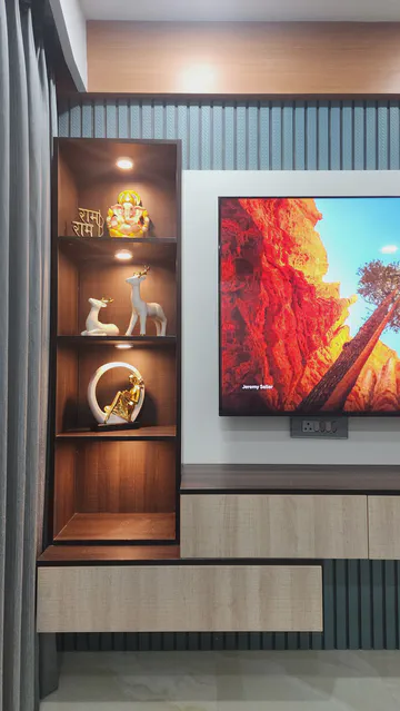 Luxurious entertainment wall with illuminated display niches and marble backdrop