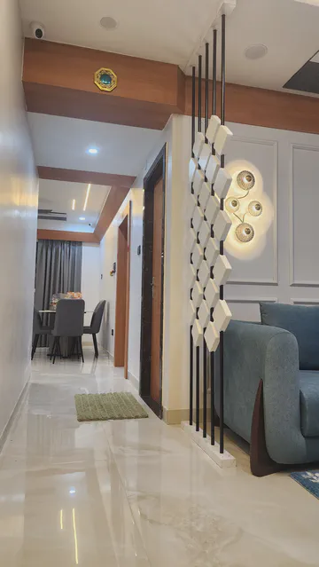 Contemporary living space with geometric ceiling design and premium finishes