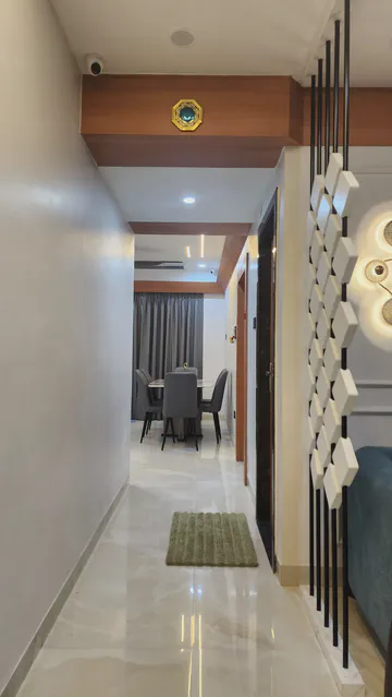 Modern bedroom with integrated wardrobe and sophisticated lighting design