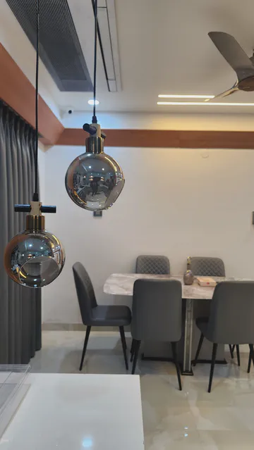 Contemporary entertainment area with artistic display and mood lighting