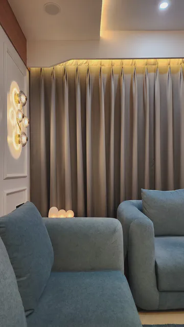 Modern living area with textured walls and sophisticated lighting elements
