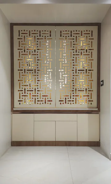 Traditional carved wooden panel with geometric patterns and warm lighting