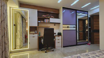 Modern bedroom with integrated study area and sophisticated storage