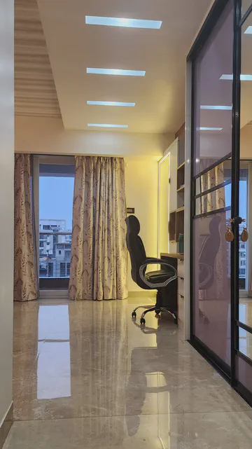 Modern bedroom with sophisticated lighting and contemporary storage solutions