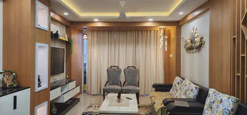 Elegant living room with warm wooden elements and sophisticated lighting